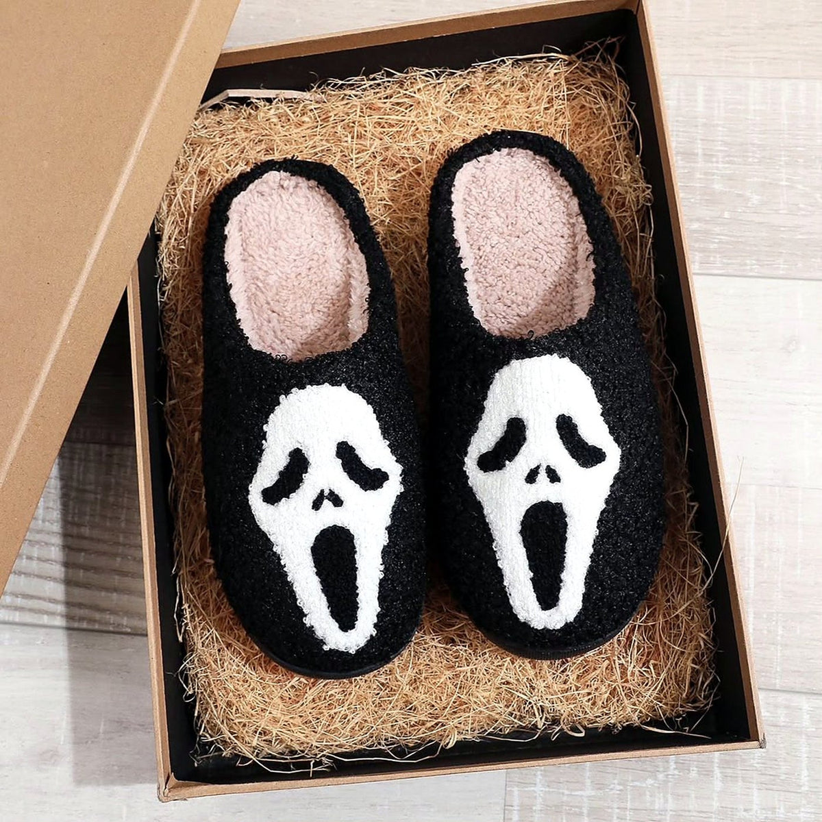 Spooky Face Fuzzy Slippers worn at home